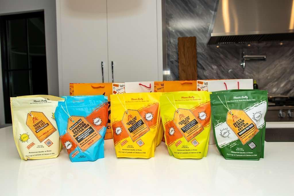 Jerk Fry Batter Mix Mild, Jerk Fry Batter Mix Spice, Truffle Jerk Fry Batter Mix Mild, Strictly Seafood Batter Mix, Zesty Lemon Here Pry Mix 5 Pack Combo sitting on the kitchen counter - Jerk Fry City